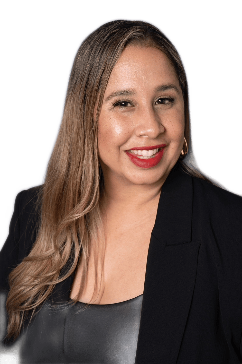 justina is smiling at the camera wearing red lipstick, brown long hair, and a black blazer
